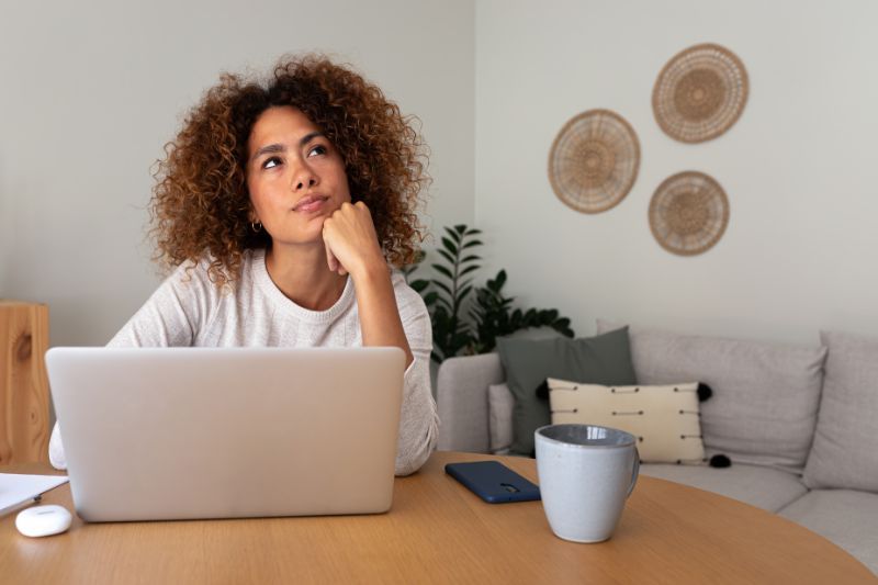 Freelancer reflecting on the best contracting option while working from home