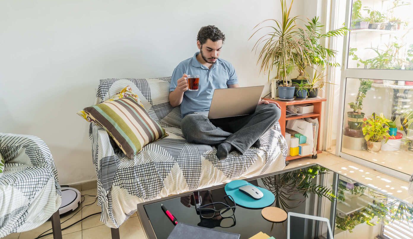 caucasian-man-with-headphones-and-a-cup-of-tea-wor-2025-02-08-21-32-26-utc.jpeg